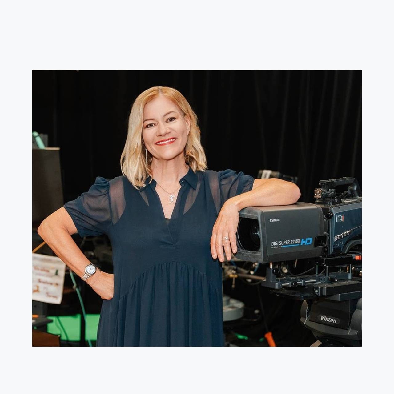 Mary Lambie leaning on a camera